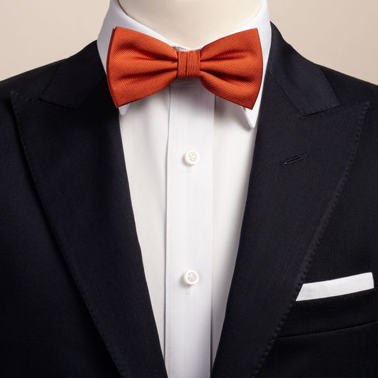 black suit orange bow tie