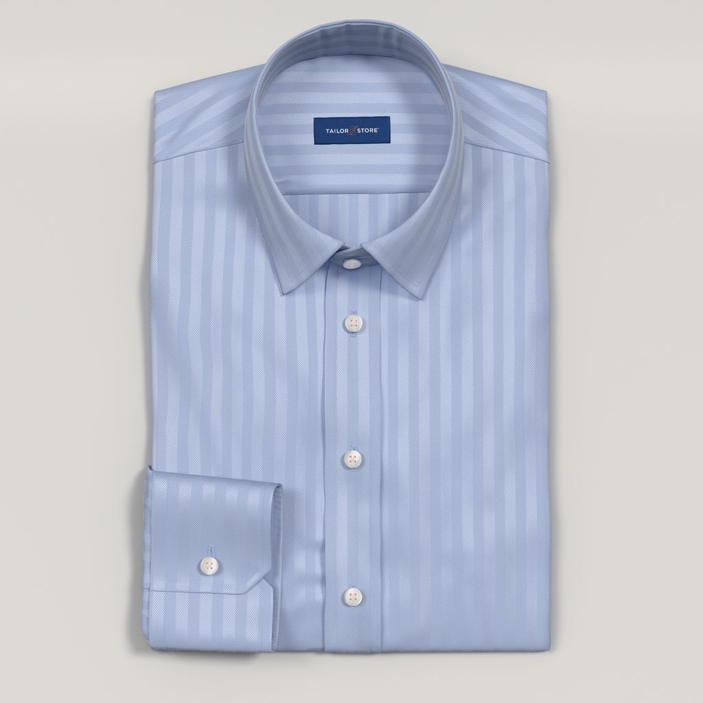 Chemise business bleue dans un herringbone luxueux.