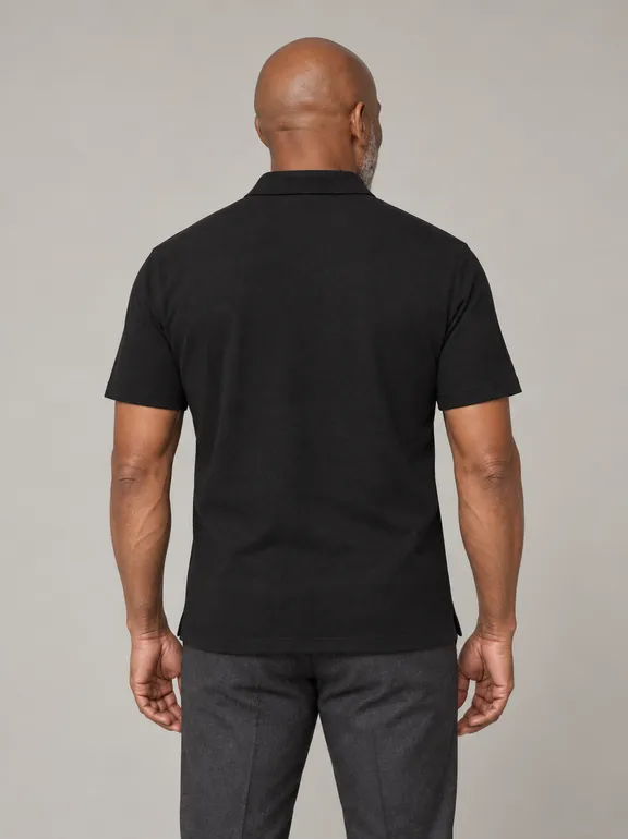 13927-grindlays-black-polo_short_sleeve_polo_collar_two_buttons_fabric_4610_model_035_pose_013_polo_regular_material_pima_pique_bg_11_nopocket_untucked_e0g0h0_upper_body_back.png
